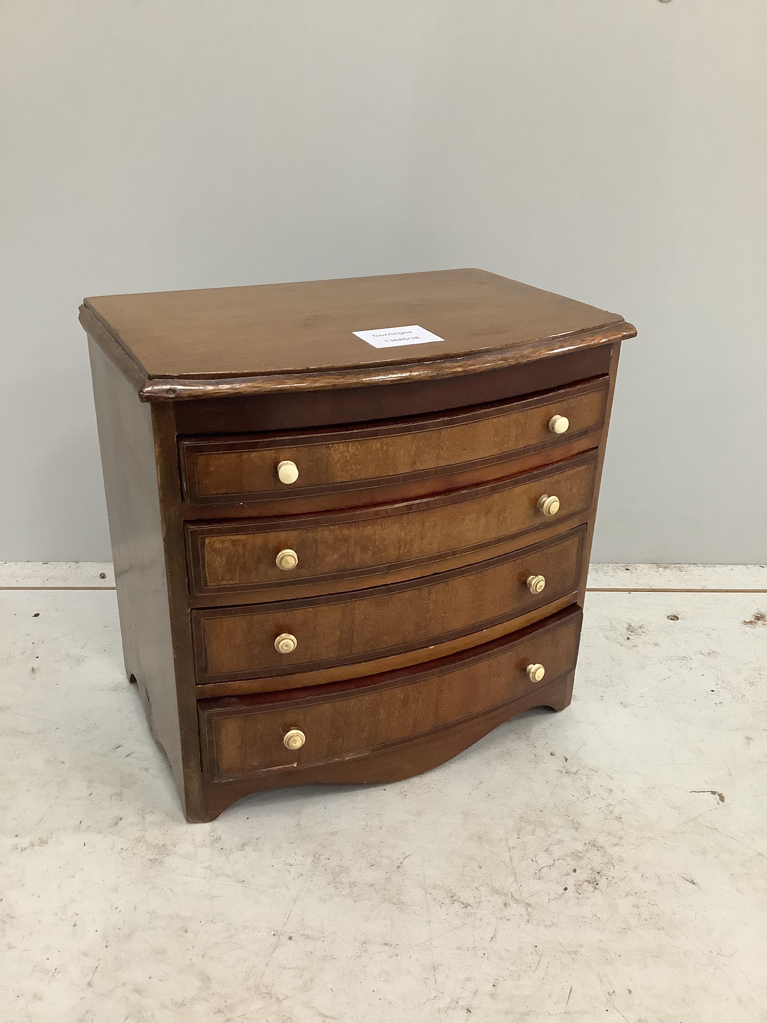 A 19th century miniature mahogany bowfront chest of four drawers, width 29cm, depth 20cm, height 28cm CITES Submission reference A647L6SD